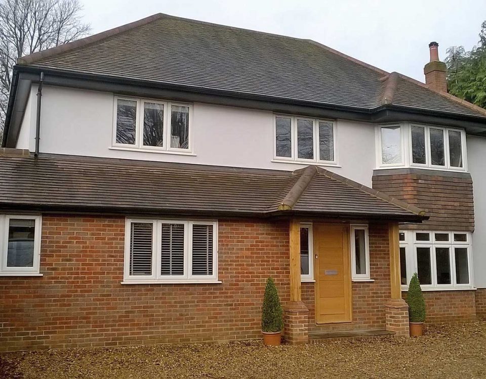 Bungalow conversion into 5 bedroom home. Large detached brick and rendered five bedroom house with bay windows.