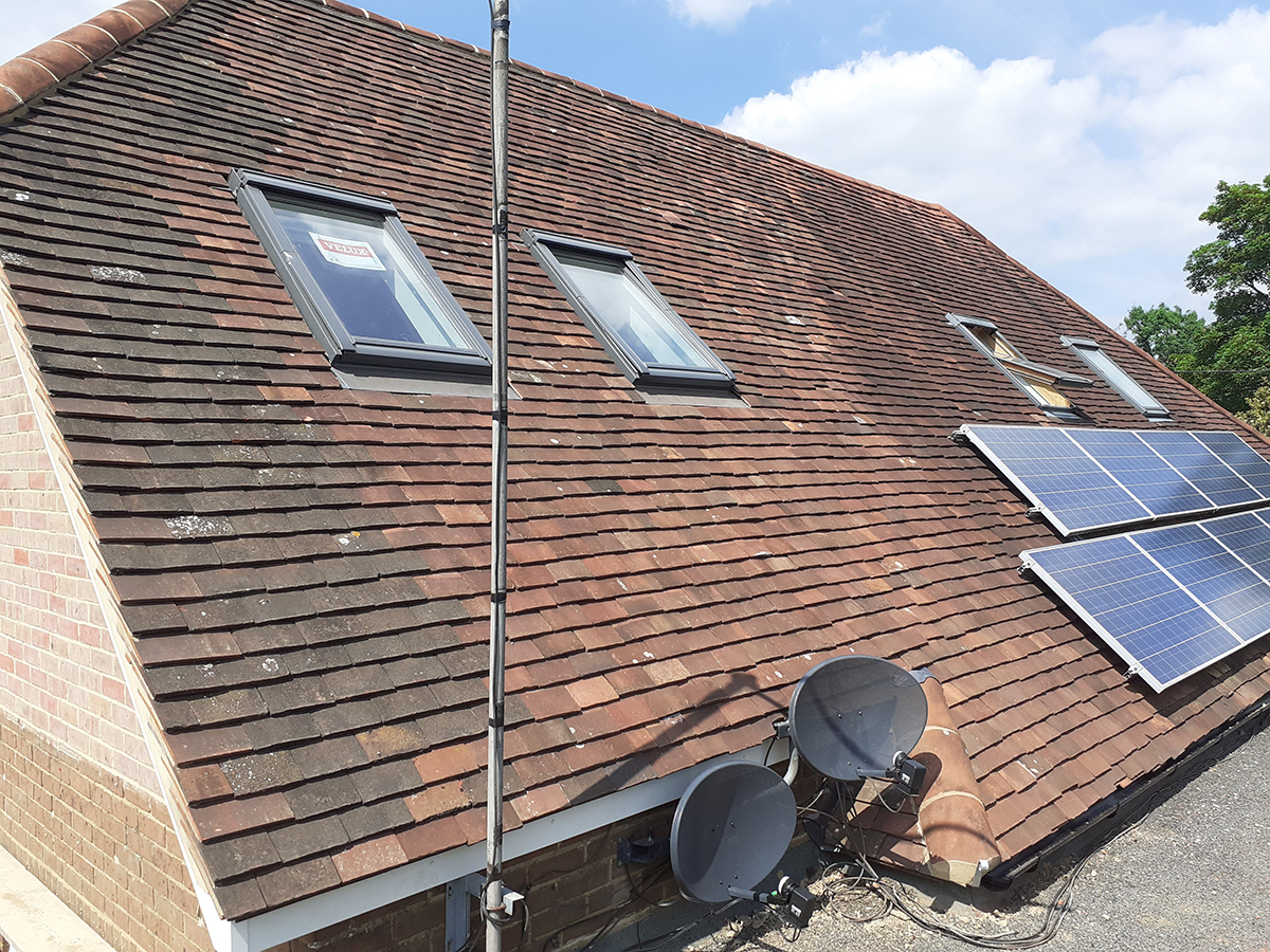 image of red tiled roof with new vellux windows and roof work for loft extension